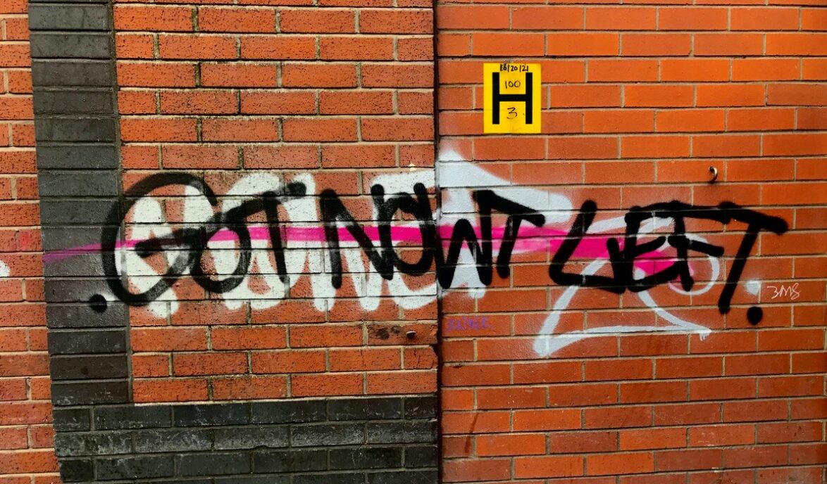 Graffiti on a brick wall reading 'Got Nowt Left' in large letters.