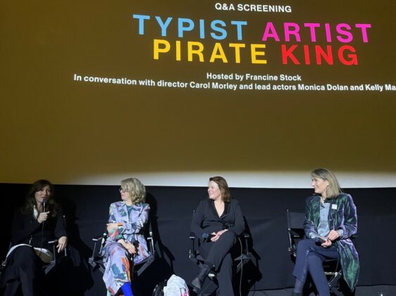 The Q&A session at the premiere of Typist, Artist, Pirate, King showing four women on stage with the film's title on a screen behind them