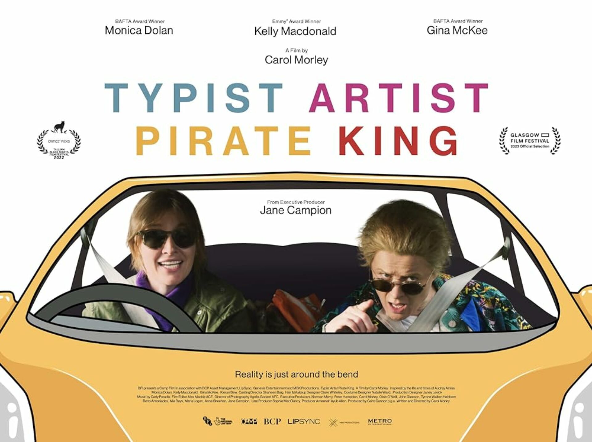 A film poster for 'Typist, Artist, Pirate, King' showing two people in a car, one wearing sunglasses and the other pointing directly at the camera.